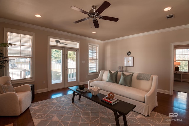 living room with crown molding, french doors, and wood-type flooring