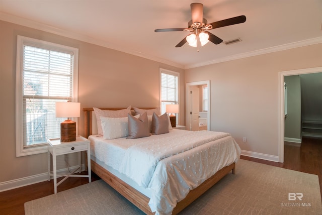 bedroom featuring multiple windows, ornamental molding, and dark hardwood / wood-style floors