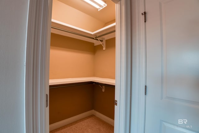 spacious closet with built in desk