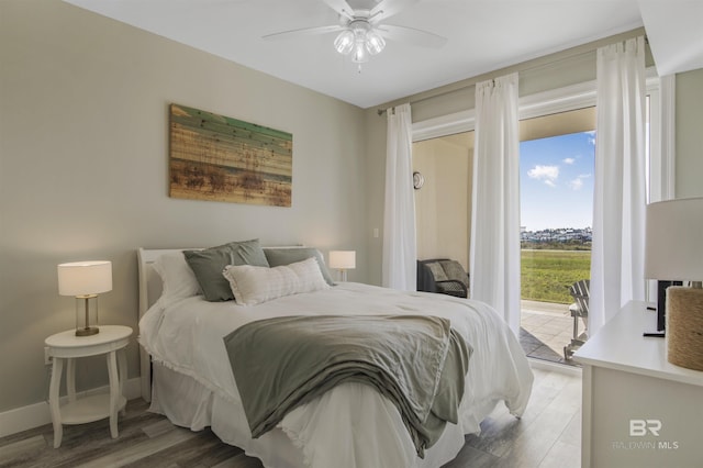 bedroom with ceiling fan, access to outside, and hardwood / wood-style flooring