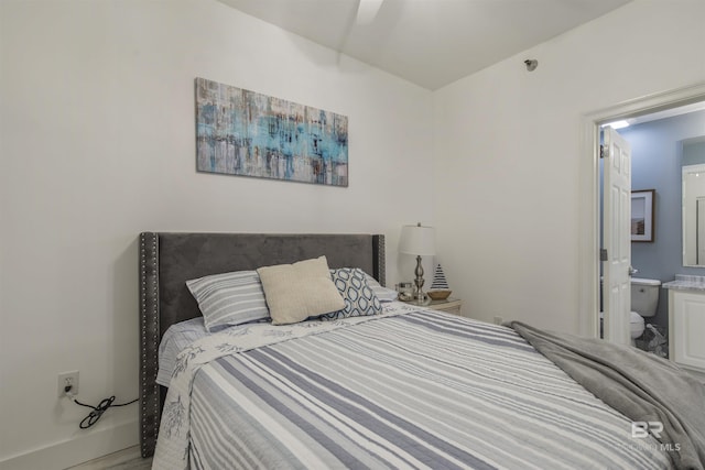 bedroom with connected bathroom and ceiling fan