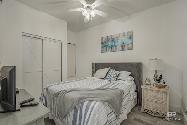 bedroom with ceiling fan and wood-type flooring