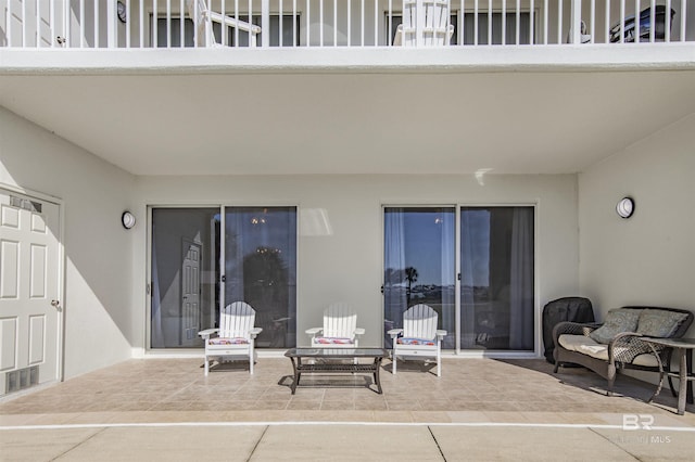 view of patio with a balcony