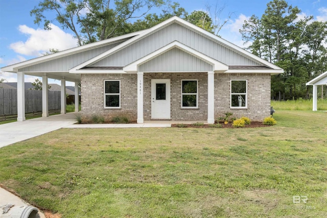 craftsman inspired home featuring a carport and a front yard