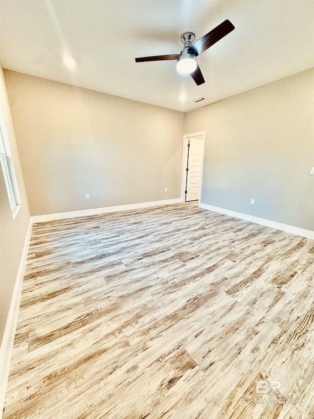 unfurnished room with ceiling fan and light hardwood / wood-style floors