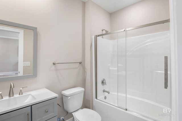 full bathroom with bath / shower combo with glass door, vanity, and toilet