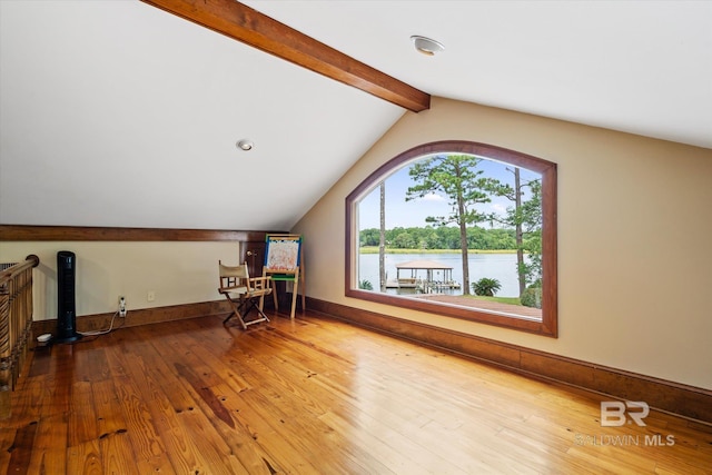 bonus room with a water view, wood-type flooring, and lofted ceiling with beams