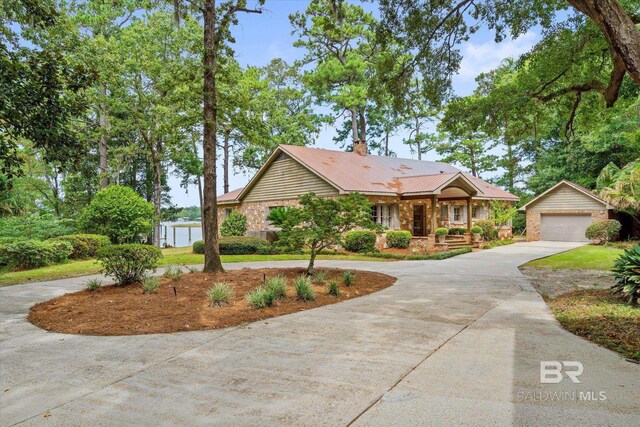 view of front of home featuring a garage and a porch