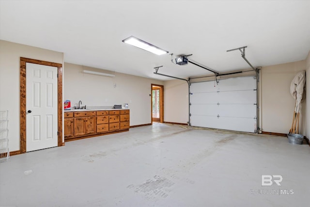 garage featuring a garage door opener and sink