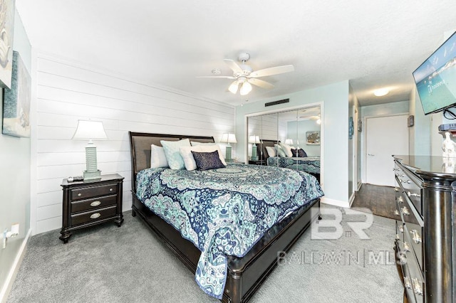 carpeted bedroom with ceiling fan