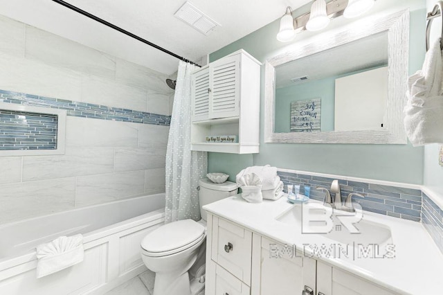 full bathroom with shower / bath combo with shower curtain, vanity, and toilet