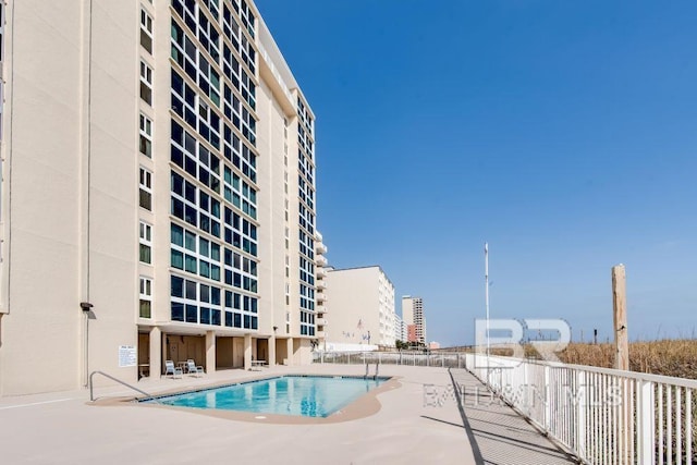 view of pool featuring a patio area