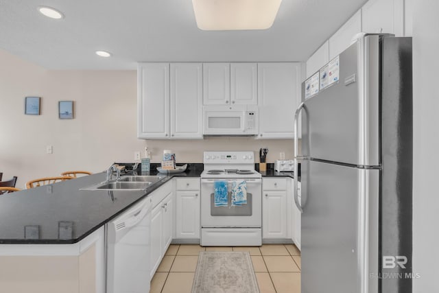 455 E Beach Blvd Unit 511, Gulf Shores, AL 36542 - kitchen featuring white cabinetry, white appliances, a peninsula, and a sink