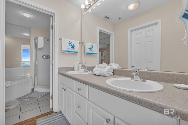 455 E Beach Blvd Unit 511, Gulf Shores, AL 36542 - bathroom with tile patterned floors, visible vents, double vanity, and a sink