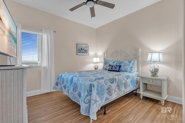 455 E Beach Blvd Unit 511, Gulf Shores, AL 36542 - bedroom with a ceiling fan, wood finished floors, and baseboards