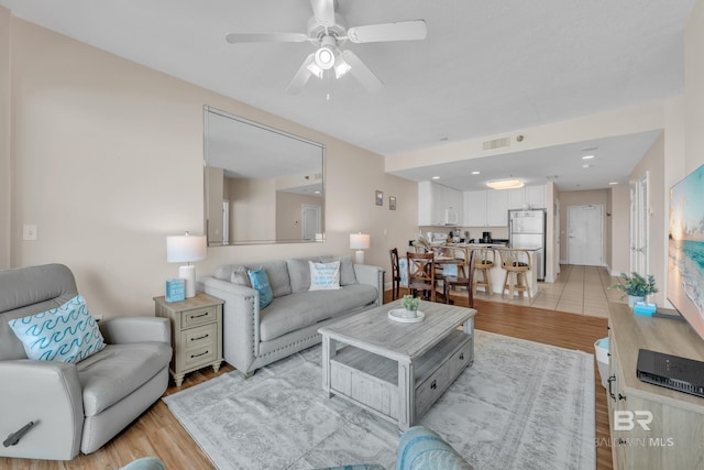 455 E Beach Blvd Unit 511, Gulf Shores, AL 36542 - living room with visible vents, ceiling fan, and light wood finished floors
