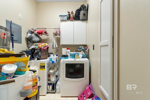 4001 Landfall Dr, Pensacola, FL 32507 - laundry room featuring cabinet space and light tile patterned floors