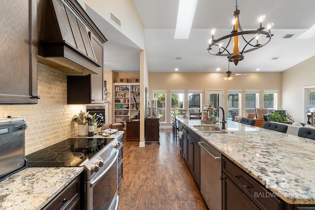 4001 Landfall Dr, Pensacola, FL 32507 - kitchen with a sink, appliances with stainless steel finishes, premium range hood, open floor plan, and visible vents