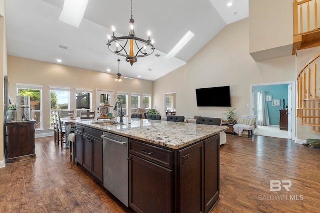 4001 Landfall Dr, Pensacola, FL 32507 - kitchen featuring open floor plan, a sink, a skylight, and dishwasher