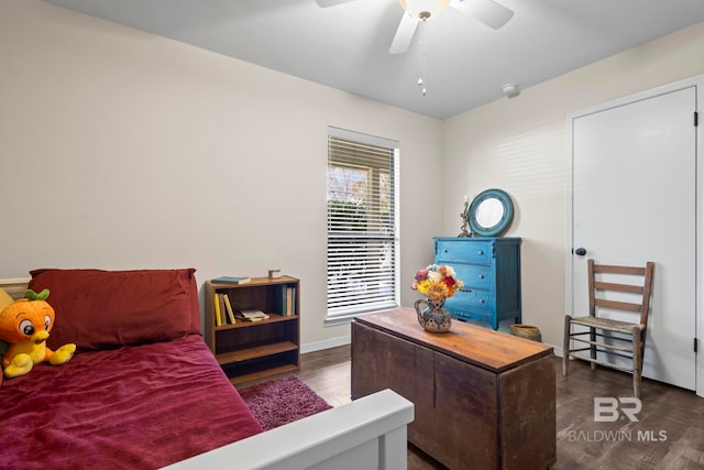 bedroom featuring ceiling fan and dark hardwood / wood-style floors