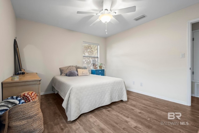 bedroom featuring ceiling fan and dark hardwood / wood-style flooring