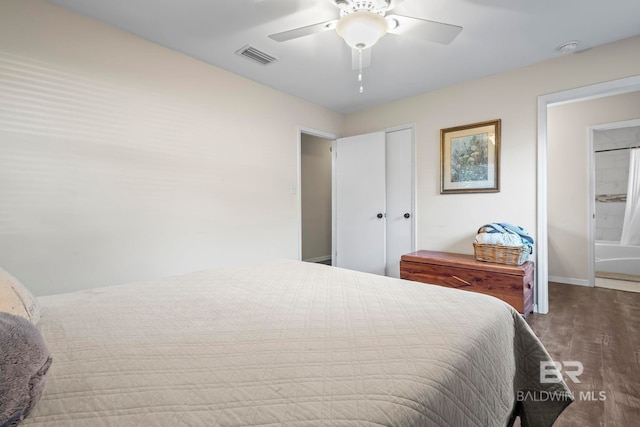 bedroom with hardwood / wood-style flooring, ceiling fan, and a closet