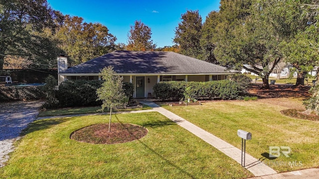 ranch-style house featuring a front lawn