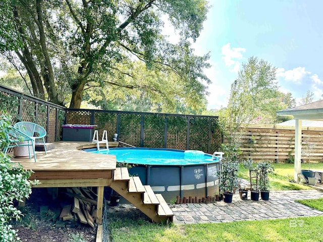 view of swimming pool with a wooden deck