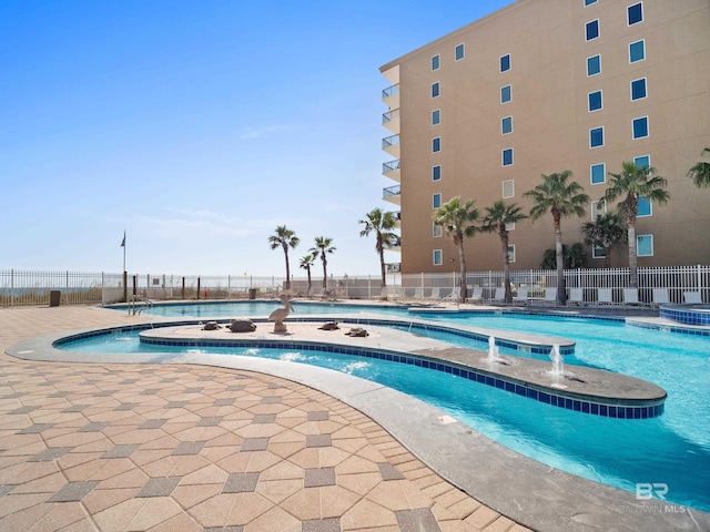 view of swimming pool featuring pool water feature