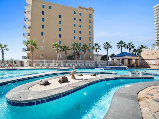 view of swimming pool featuring a gazebo and pool water feature