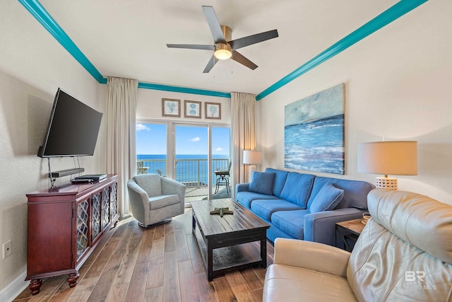 living room featuring hardwood / wood-style floors and ceiling fan