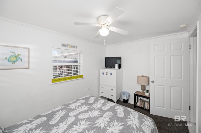 bedroom with ceiling fan, ornamental molding, and dark colored carpet