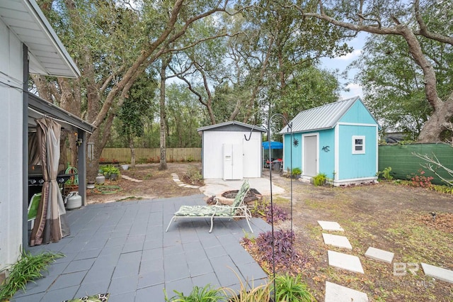 view of patio / terrace with a storage shed