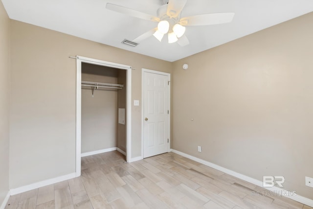 unfurnished bedroom with light wood-type flooring, a closet, and ceiling fan