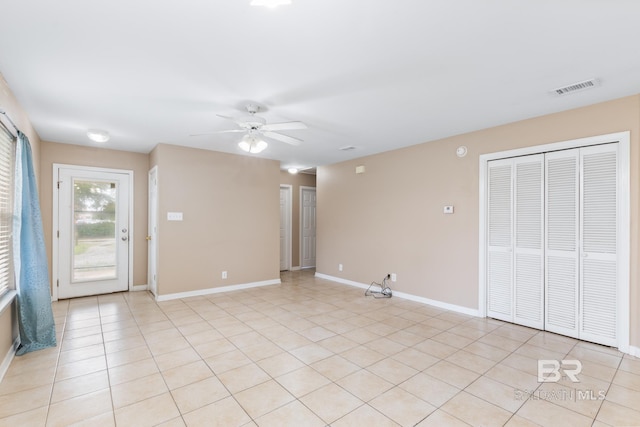 interior space featuring ceiling fan