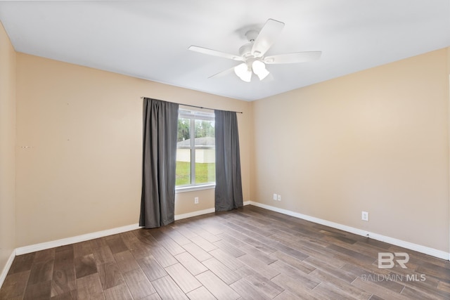 empty room featuring ceiling fan and wood-type flooring