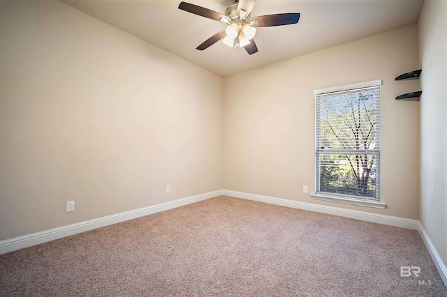 empty room with ceiling fan and carpet flooring