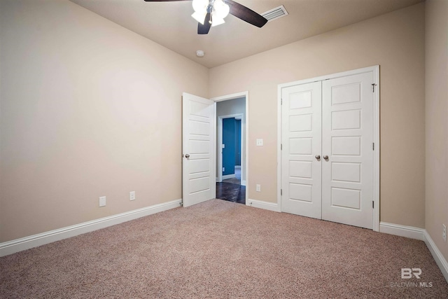 unfurnished bedroom featuring ceiling fan, carpet floors, and a closet