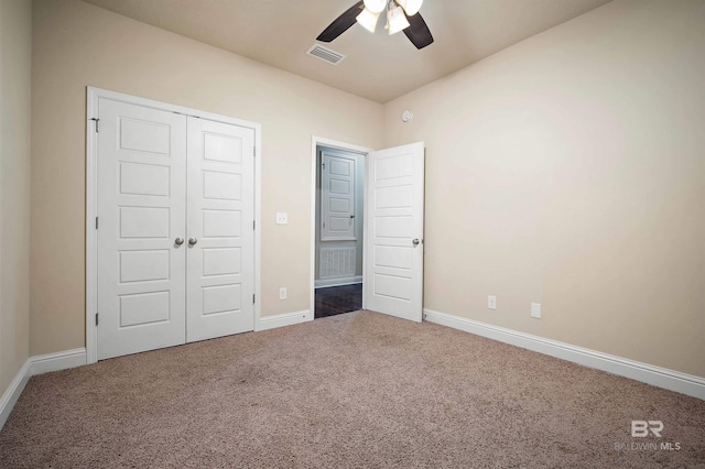 unfurnished bedroom featuring ceiling fan, carpet floors, and a closet