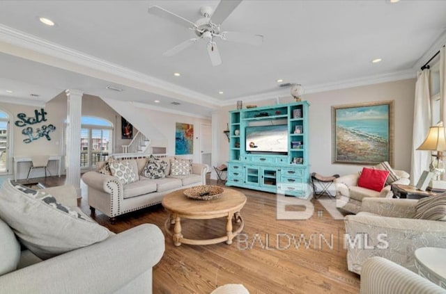 2223 W Beach Blvd, Gulf Shores, AL 36542 - living area featuring ornate columns, stairs, ornamental molding, wood finished floors, and a ceiling fan