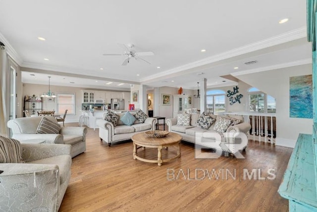 2223 W Beach Blvd, Gulf Shores, AL 36542 - living room featuring crown molding, baseboards, ceiling fan, wood finished floors, and recessed lighting