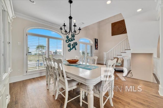2223 W Beach Blvd, Gulf Shores, AL 36542 - dining room featuring stairs, a chandelier, light wood-type flooring, baseboards, and recessed lighting