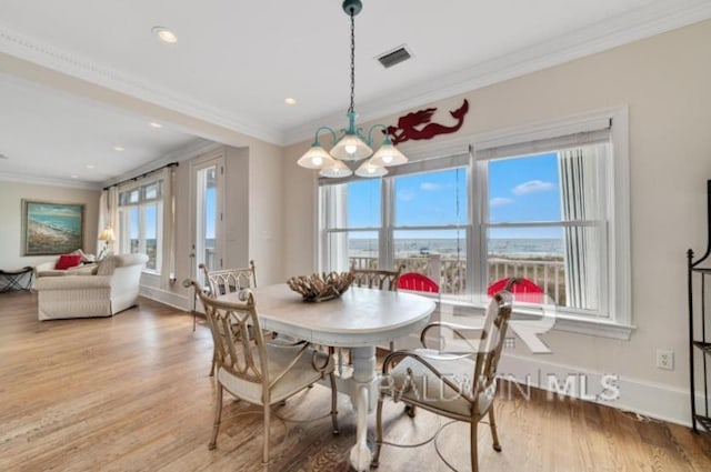 2223 W Beach Blvd, Gulf Shores, AL 36542 - dining area featuring visible vents, baseboards, ornamental molding, wood finished floors, and recessed lighting