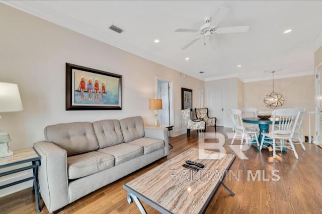 2223 W Beach Blvd, Gulf Shores, AL 36542 - living room with visible vents, recessed lighting, crown molding, and wood finished floors