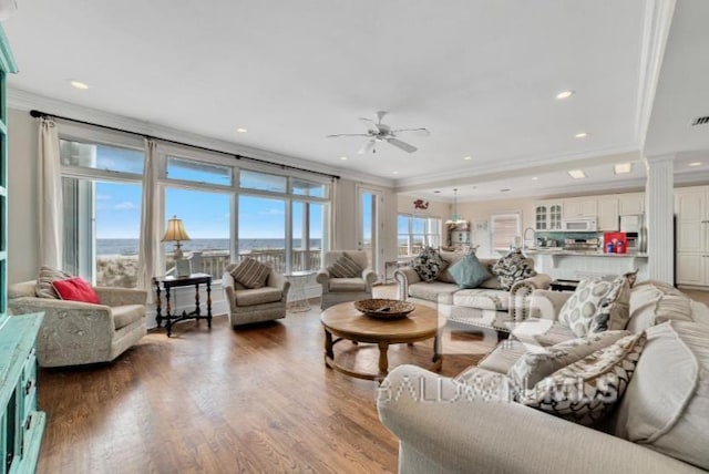 2223 W Beach Blvd, Gulf Shores, AL 36542 - living room featuring visible vents, wood finished floors, ceiling fan, and ornamental molding
