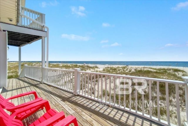2223 W Beach Blvd, Gulf Shores, AL 36542 - wooden terrace with a water view and a view of the beach