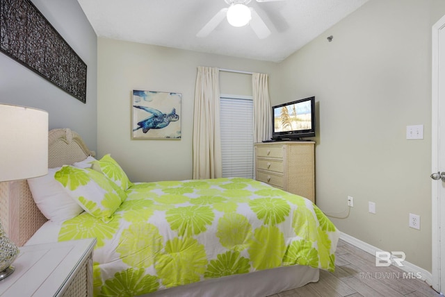 bedroom featuring ceiling fan and light wood-type flooring