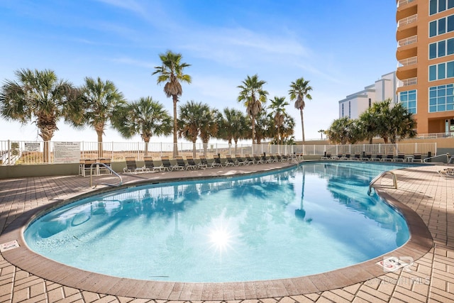 view of swimming pool with a patio