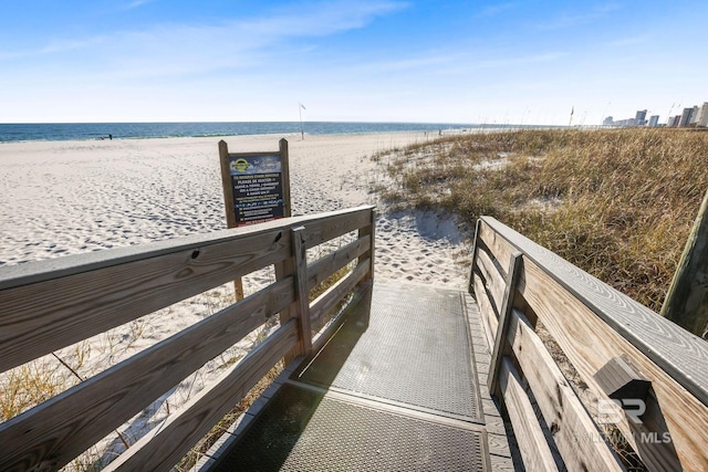 view of property's community with a view of the beach and a water view