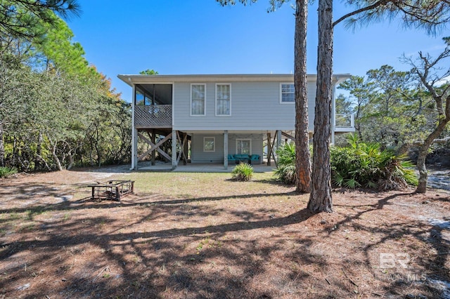 back of house with a patio area